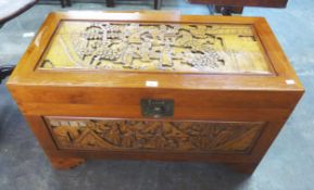 A MODERN SOUTH EAST ASIAN CARVED CAMPHOR-WOOD CHEST, 40" (101.5CM) LONG, WITH AN ACCOMPANYING