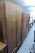 1970's TEAK TWO DOOR WARDROBE AND MATCHING GENT'S WARDROBE AND A KNEEHOLE DRESSING TABLE WITH