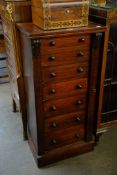 A LATE VICTORIAN MAHOGANY WELLINGTON CHEST OF SEVEN DRAWERS