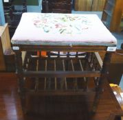 A LATE VICTORIAN OPEN FRAMED STOOL WITH PAPER-RACK STRETCHER AND FLORAL DECORATED NEEDLEWORK SEAT