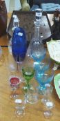 TWO CUT GLASS DECANTERS AND STOPPERS, THREE PALE BLUE GLASS WINE GOBLETS AND MISC VINTAGE WINE