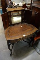 AN EARLY TWENTIETH CENTURY WALNUT DRESSING TABLE CABINET, ON CABRIOLE LEGS AND HIDDEN MIRROR