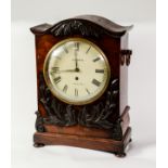 EARLY VICTORIAN CARVED MAHOGANY CASED BRACKET CLOCK SIGNED GODDEN, HADLOW, the 8” Roman dial powered