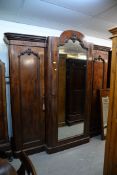 VICTORIAN MAHOGANY BREAKFRONT TRIPLE WARDROBE, WITH MIRRORED CENTRAL DOOR, OPENING TO REVEAL PRESS