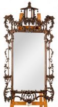 MODERN CHIPPENDALE STYLE MIRROR: 20th century stained pine Chippendale style wall mirror with pagoda