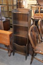 AN OAK NARROW PERIODICAL RACK/BOOKCASE