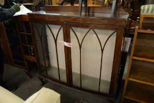 A MAHOGANY BOW FRONT DISPLAY CABINET, TWO DOORS ON CLAW AND BALL FEET
