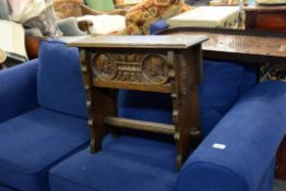 A PRE-WAR CARVED OAK STOOL WITH LIFT-UP BOX TOP