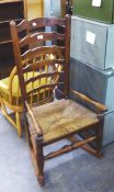 A LADDERBACK RUSH SEAT COUNTRY ROCKING CHAIR