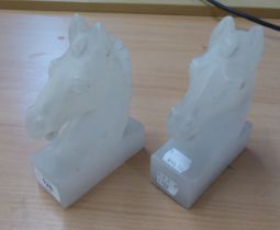 TWO CARVED ALABASTER HORSE HEAD BOOKENDS, 16cm HIGH (SLIGHT CHIPPING TO EARS AND BASES)