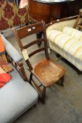 A VICTORIAN COUNTRY ROCKING CHAIR, WITH PANEL SEAT