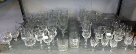 A SUITE OF LEAD CRYSTAL STEM WINE GLASSES OF VARIOUS SIZES; A CUT GLASS LAMP SHADE AND TWO BOWLS