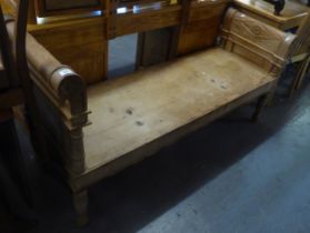 A DOUBLE SCROLL ENDED ORNATE BENCH, RAISED ON TURNED SUPPORTS