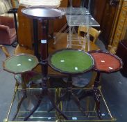 THREE TRIPOD WINE TABLES WITH COLOURED LEATHER INSET TOPS AND A TRIPOD JARDINIERE STAND (4)