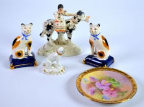 NINETEENTH CENTURY DERBY PORCELAIN MODEL OF A SEATED PUG, heightened in gilt and raised on an