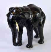 LIBERTY’S STYLE MODERN BLACK LEATHER COVERED MODEL OF AN ELEPHANT, with trunk down, flapping ears
