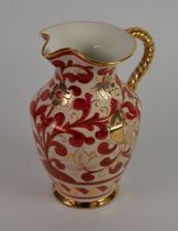 DURUTA, ITALIAN POTTERY JUG, with rope twist loop handle, painted in red and gold with an incised