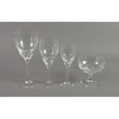 SCANDINAVIAN GLASS: Kosta Boda style stemware suite of lead crystal glasses with stylised flower bud