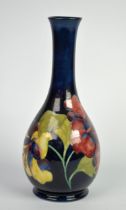 MOORCROFT: MID-CENTURY MOORCROFT POTTERY SPRINKLER VASE, in the Hibiscus pattern on blue ombre, c.