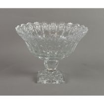 HEAVY CUT GLASS PEDESTAL BOWL, of flared form with facet cut orbicular support and stepped square