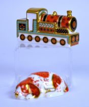 ROYAL CROWN DERBY: TWO PAPERWEIGHTS, modelled as a Collector's Guild recumbent spaniel, Poppy and