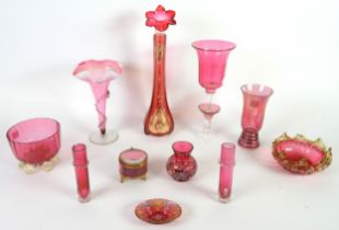 SELECTION OF CRANBERRY GLASS, to include; TRUMPET VASE WITH WAVY VASELINE GLASS RIM, 8” (20.3cm)