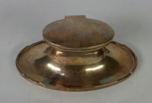 GEORGE V PRESENTATION WEIGHTED SILVER LARGE CAPSTAN INKSTAND, of oval form with glass liner and