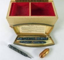 CONWAY STEWART WRITING SET, comprising a dark blue marbled plastic fountain pen with 14ct gold