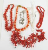 TWO RED BRANCH CORAL NECKLACES; a red coral two strand BEAD NECKLACE; two crystal BEAD NECKLACES and