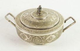 MIDDLE EASTERN SILVER COLOURED METAL TWO HANDLED SUGAR BOWL AND COVER, of footed form with angular