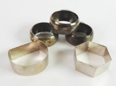 GEORGE V SET OF THREE ENGINE TURNED SILVER NAPKIN RINGS, Birmingham 1919, together with TWO