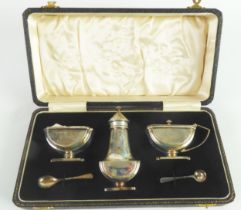 CASED ART DECO SILVER THREE PIECE SILVER PEDESTAL CONDIMENT SET BY ERNEST W HAYWOOD, of semi-