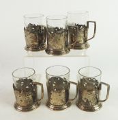 SET OF SIX RUSSIAN SILVER COLOURED METAL (84 MARK) CUP HOLDERS, each with angular scroll handle,