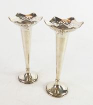 GEORGE V PAIR OF WEIGHTED SILVER TRUMPET VASES, with shaped rims, pierced borders and circular
