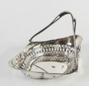 GEORGE V PIERCED SILVER SWING HANDLED DISH, of lozenge form with pierced border and wire pattern