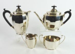 SILVER TEA SET: George V heavy gauge silver four piece tea set of elliptical faceted form, including