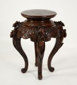 CHINESE VASE STAND: c.1900 mahogany Chinese vase stand, with carved Iris decoration and on