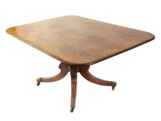 WILLIAM IV FIGURED MAHOGANY PEDESTAL DINING TABLE, the rounded oblong snap top above a heavy turned