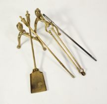 PAIR OF BRASS ANDIRONS, with fluted urn shaped finials and paw feet, together with a SET OF THREE