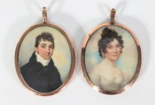 TWO REGENCY PERIOD PORTRAIT MINIATURES on ivory; one as a lady in Empire line dress, the other of