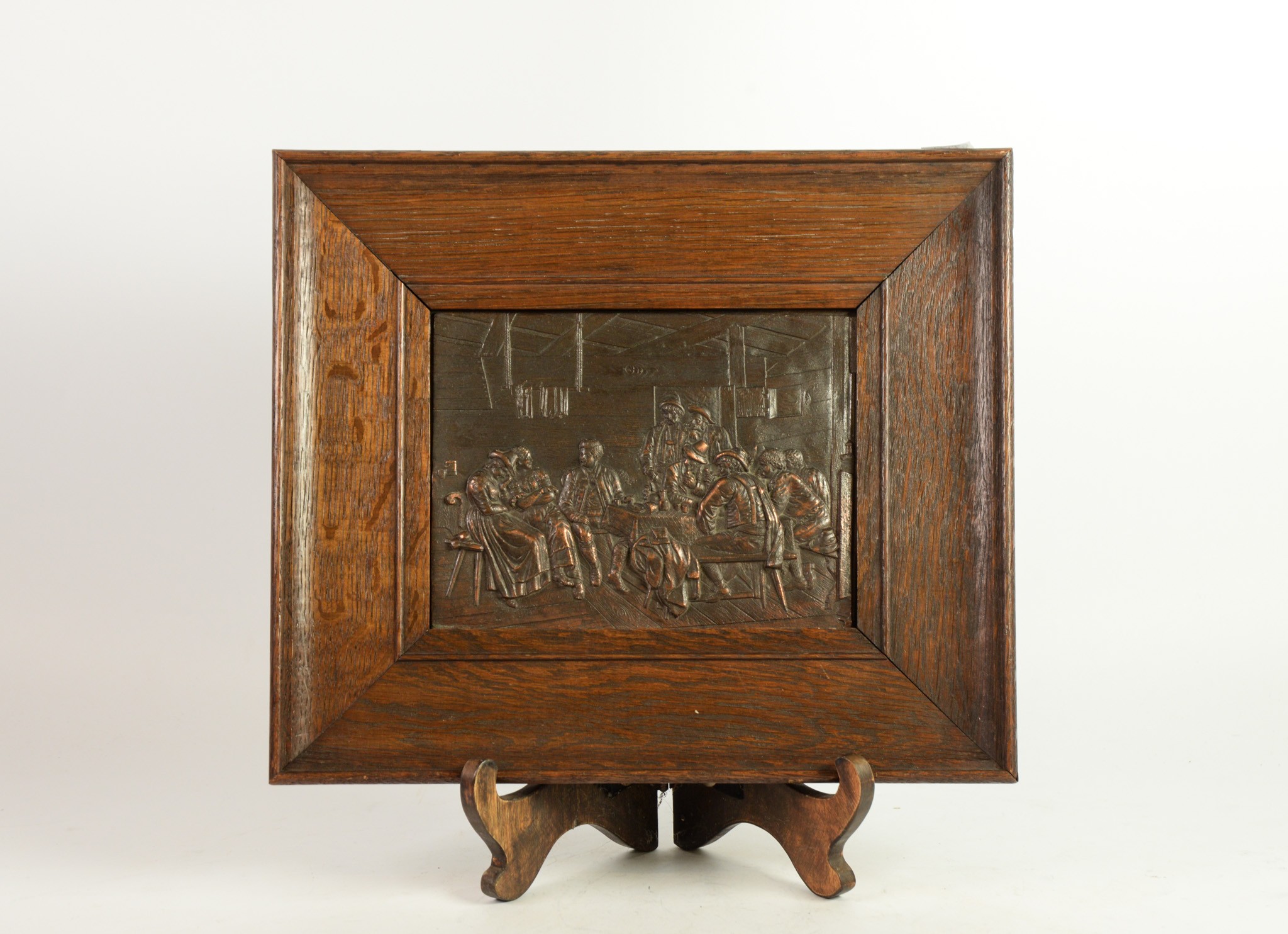 EARLY TWENTIETH CENTURY EMBOSSED COPPER PLAQUE, OF OBLONG FORM IN MOULDED OAK FRAME, depicting