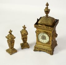 EARLY TWENTIETH CENTURY FRENCH BRASS THREE PIECE CLOCK GARNITURE, the CLOCK with 3 ½” Arabic dial,