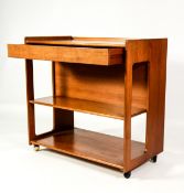 MACKINTOSH, 1970’s TEAK DRINKS TROLLEY. Of oblong form with two undertiers, the back folding upwards
