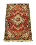 HAMADAN, PERSIAN RUG with off-white diamond shaped centre medallion with pendants and spandrels,