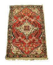 HAMADAN, PERSIAN RUG with off-white diamond shaped centre medallion with pendants and spandrels,