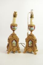 PAIR OF PORCELAIN MOUNTED GILT METAL TABLE LAMPS, each of square form with pedestal vase surmount