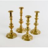 TWO PAIRS OF POLISHED BRASS EJECTOR CANDLESTICKS, one pair with octagonal bases, the other with