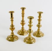 TWO PAIRS OF POLISHED BRASS EJECTOR CANDLESTICKS, one pair with octagonal bases, the other with