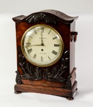EARLY VICTORIAN CARVED MAHOGANY CASED BRACKET CLOCK SIGNED GODDEN, HADLOW, the 8” Roman dial powered