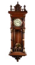 GUSTAV BECKER, EARLY TWENTIETH CENTURY GILT METAL MOUNTED CARVED OAK WALL CLOCK, the 6” two part